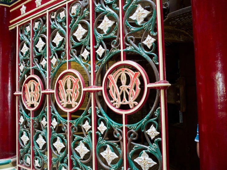 Metalwork with a red-and-gold logo in the middle of the frame.